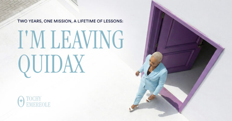 Tochy in a light blue suit walking through a purple door